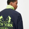 Navy blue coach jacket with neon detail – Image 3